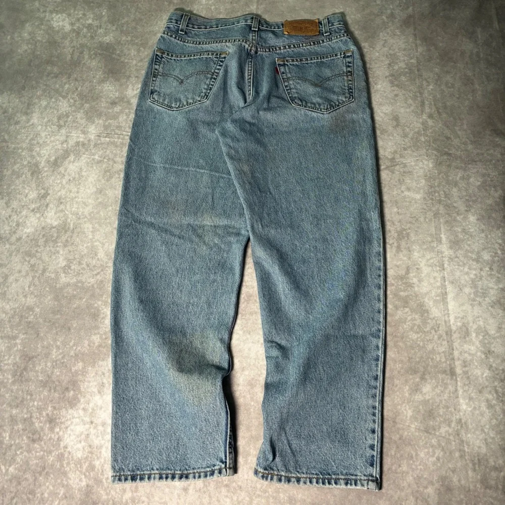 Vintage Levis 550 Relaxed Fit Tapered Leg Jeans Light Wash Blue 36x29 Mens 90s